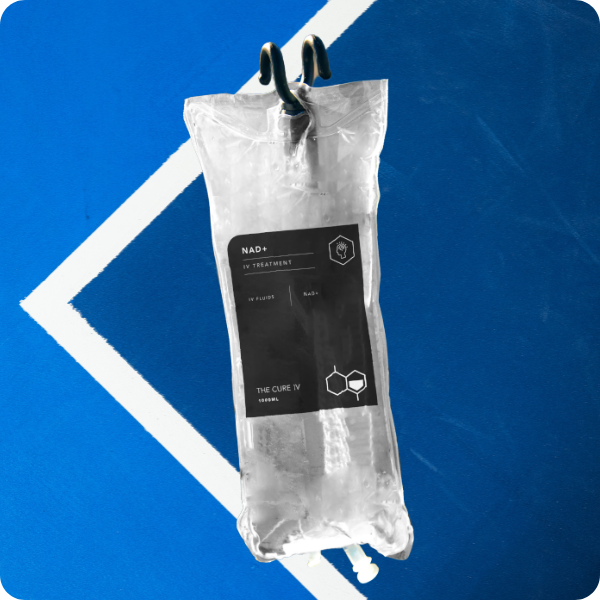 NAD+ IV treatment bag hanging on a blue Tennis court background, labeled The Cure IV, symbolizing energy restoration and cellular therapy.